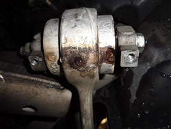 Visual sign of failed control arm bushing. The fluid has leaked out
